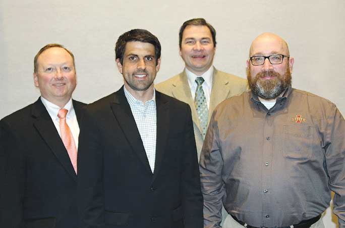 (four men standing for photo)