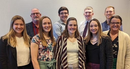 Scholarship winners standing in a group with Dr. Creel