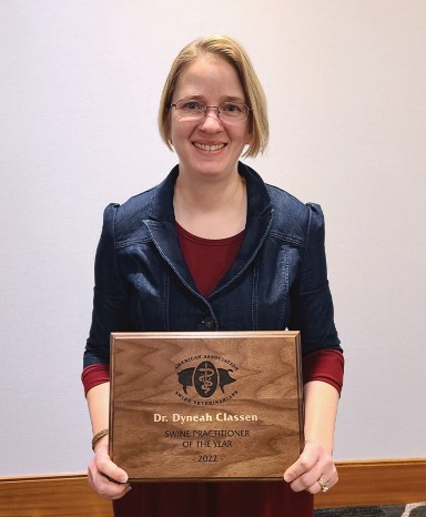 Dr. Dyneah Classen holding plaque