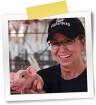 Dr. Baysinger holding a piglet